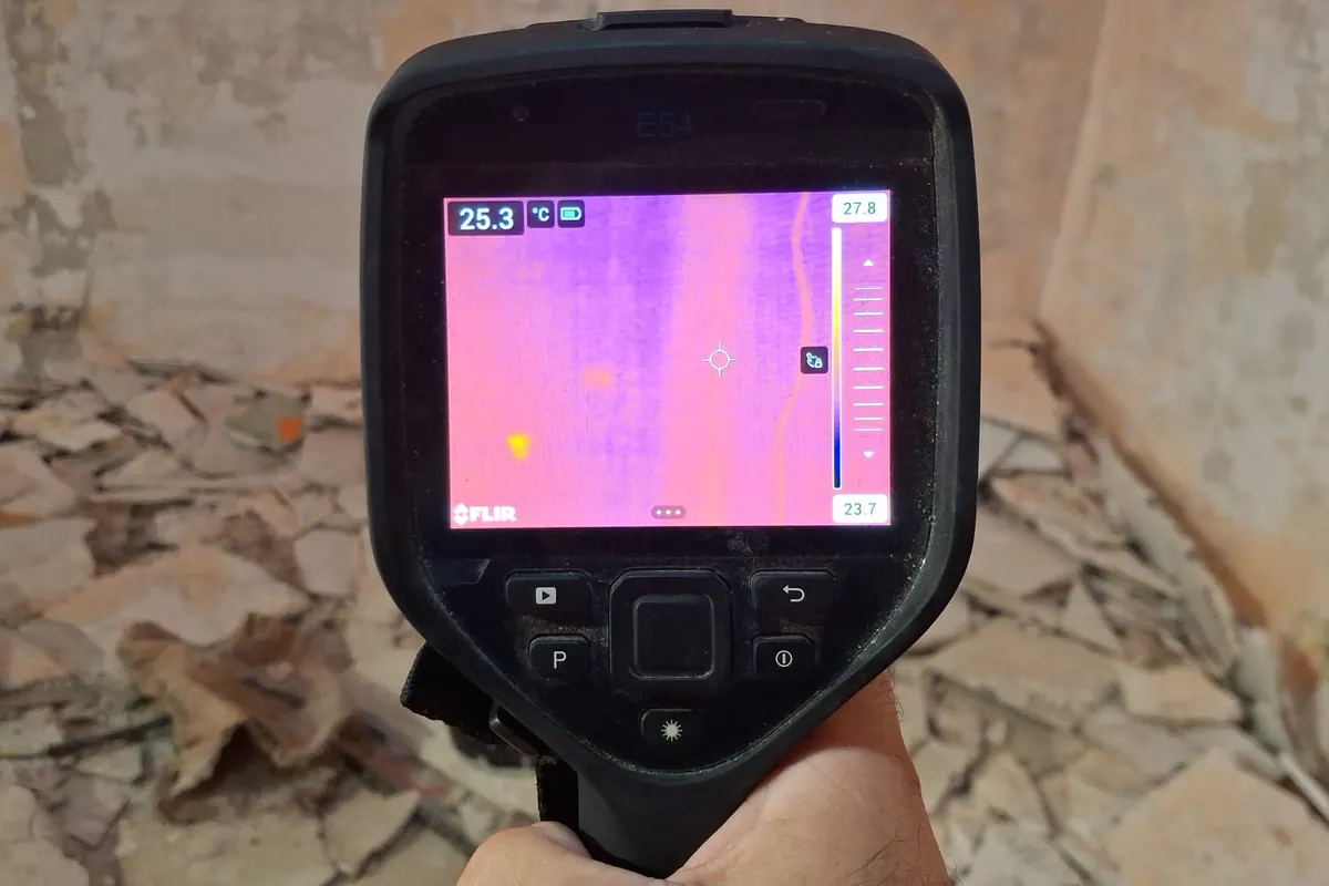 FLIR thermal camera screen showing a hidden leak reading during a Malta site inspection