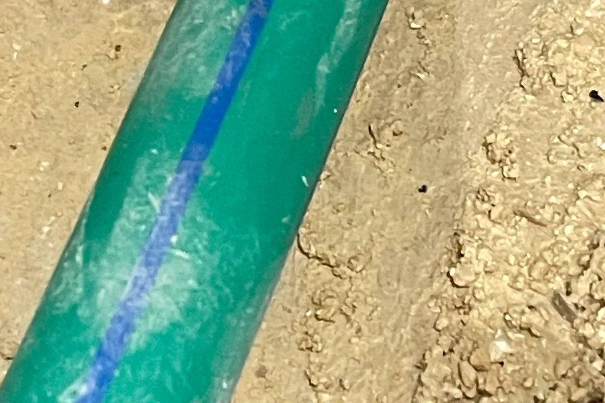 Marked water pipe section showing the suspected leak point after inspection
